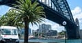 Seven Seas Worldwide vans driving under Sydney Harbour bridge 