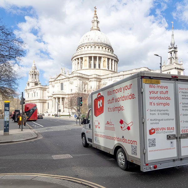 A removals van driving past St Paul's Cathedral in London