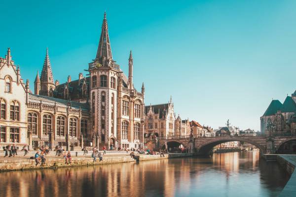 Old Gothic buildings beside a canal in Belgium