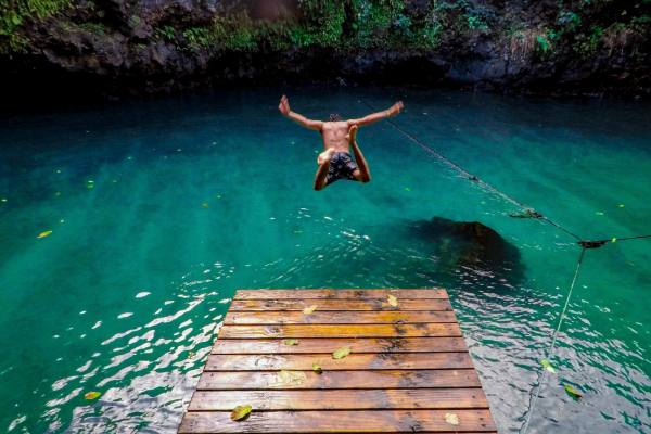 Man diving in water in Samoa