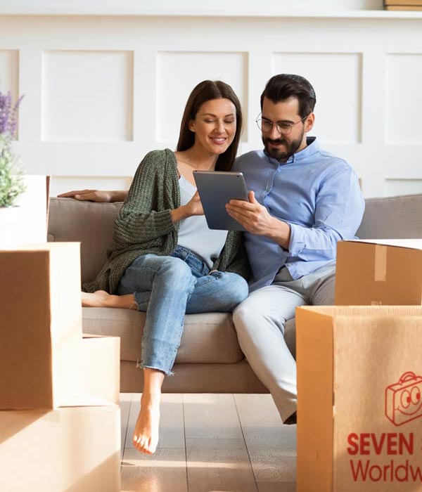 Couple reading info about relocation