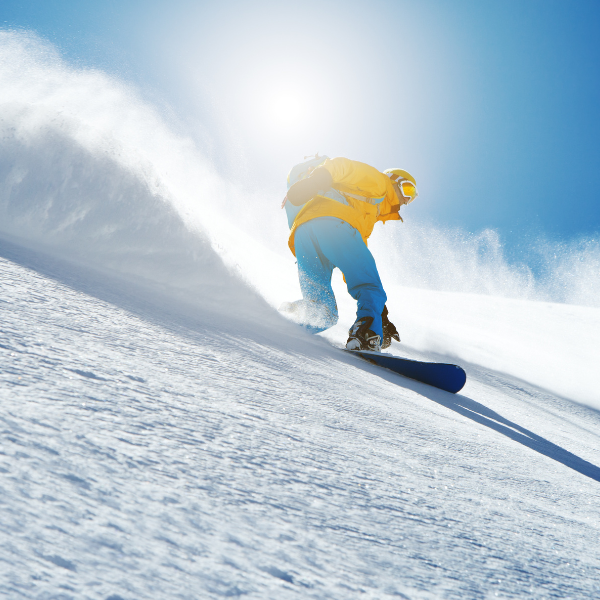 Person snowboarding down a mountain