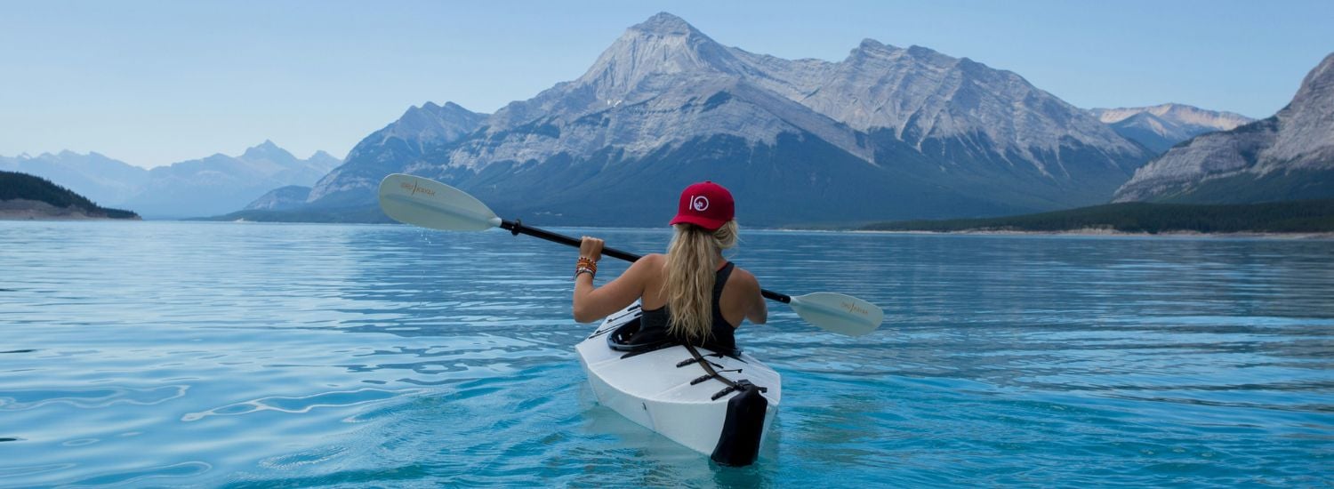 Woman canoeing on a lake in Canada