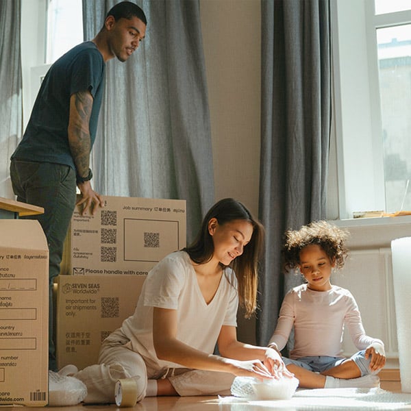 Family packing boxes together