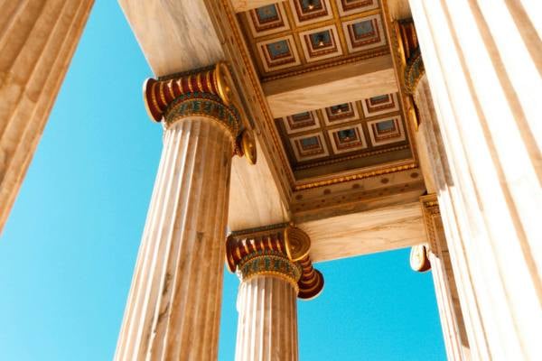 Ornate columns in a ruined Greek temple