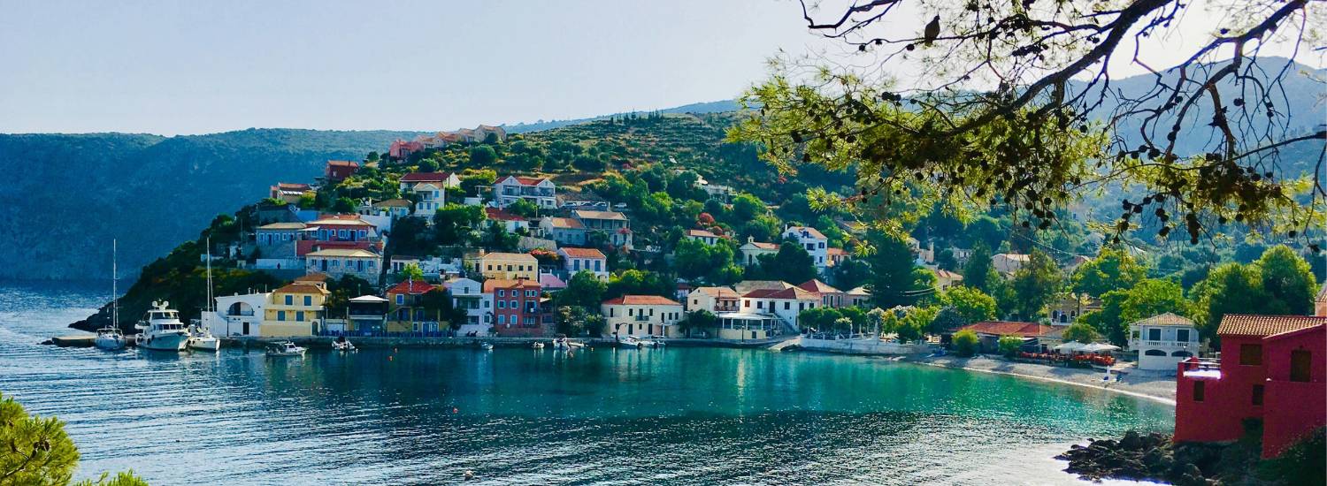 Fishing village beside a clear blue sea in Greece