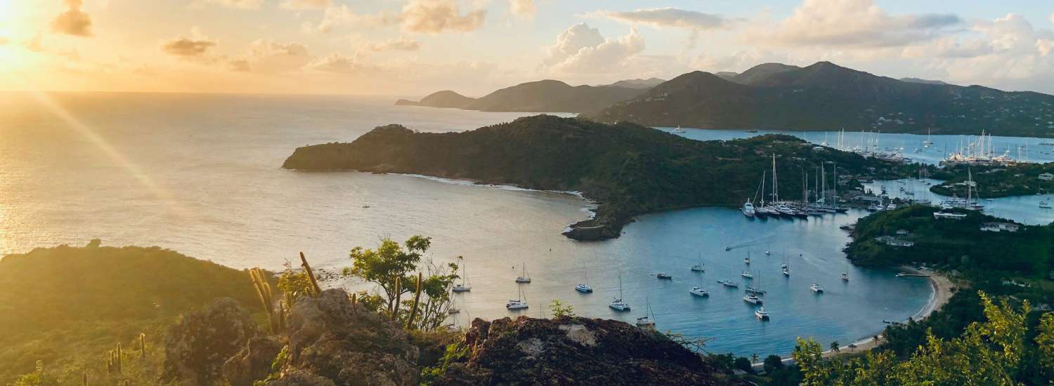 Sunset over a bay filled with boats in Antigua and Barbuda