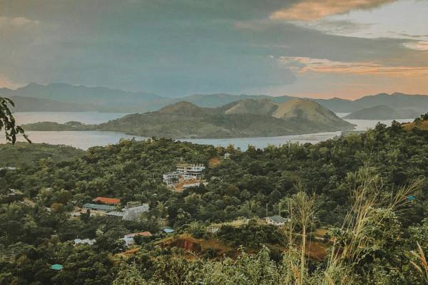 Green trees and mountains under cloudy sky during daytime in Palawan, Philippines 