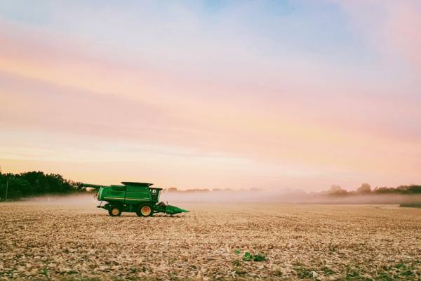 Green farm truck on a field in Illinois 