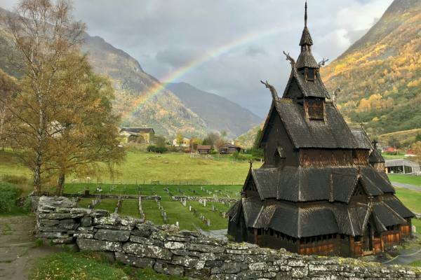 Borgund Stave Church, in Norway under a rainbow