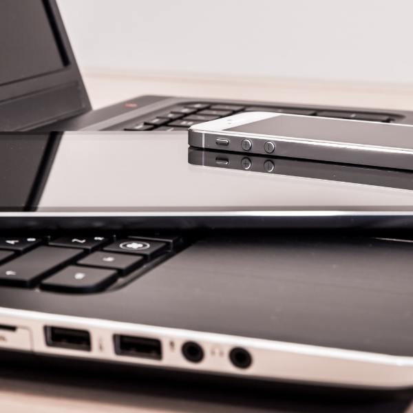 Smartphone on top of a tablet on top of a laptop