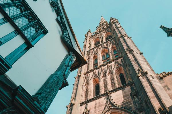 Historic Tudor style buildings adjacent to the spire of the old cathedral at Coventry