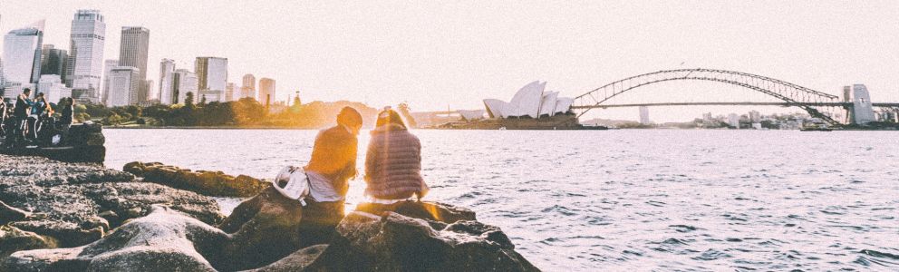 People sitting on the steps outside Sydney Opera House in Australia
